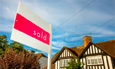 Sold sign infront of a house